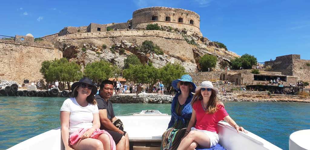 arriving in Spinalonga by boat